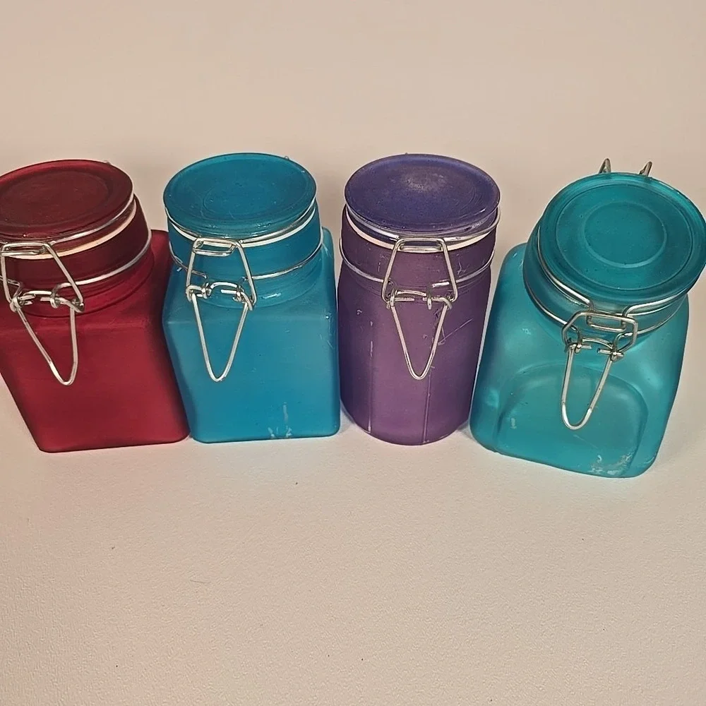 Set Of Four Colored‎ Glass Cannisters With Locking Tops Very Good Condition